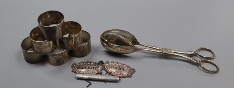 A pair of Victorian silver wine labels, pair of silver salad servers, pencil holder and six plated