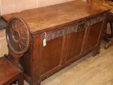 A 17th century panelled oak coffer, W.140cm, D.58cm, H79cm