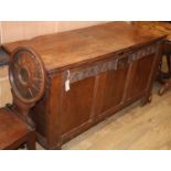 A 17th century panelled oak coffer, W.140cm, D.58cm, H79cm