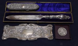 An Edwardian Art Nouveau repousse silver pin tray, William Neale, Chester, 1902, 21.9cm, a late