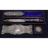 An Edwardian Art Nouveau repousse silver pin tray, William Neale, Chester, 1902, 21.9cm, a late