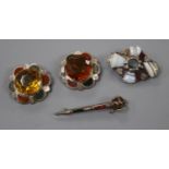 Four assorted Scottish hardstone brooches, sterling sword, two white metal mounted and one