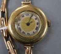 A lady's early 20th century 18ct gold manual wind wrist watch, on a 15ct flexible strap.CONDITION: A