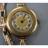 A lady's early 20th century 18ct gold manual wind wrist watch, on a 15ct flexible strap.CONDITION: A