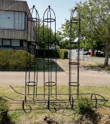 Four wrought iron garden rose frames, H.300cmCONDITION: All weathered, one has two bent post prongs,