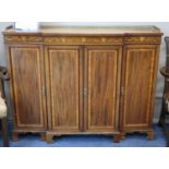 An Edwardian inlaid mahogany breakfront side cabinet, W.140cm, D.38cm, H.106cm