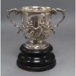 A late Victorian demi-spiral fluted silver two handled silver trophy cup, Aldwinckle & Slater,