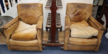 A pair of 1940's French tan leather club armchairs, W.77cm, D.74cm, H.84cm