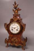 A late 19th century French tortoiseshell and ormolu mantel clock, with enamelled dial, height 38cm