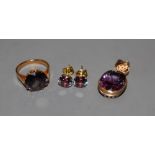 A 14k and synthetic colour change corundum pendant, a pair of similar earrings and a similar