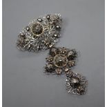 A continental pierced white and yellow metal, rose cut diamond set graduated three tier drop brooch,