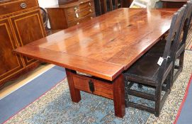 An Australian redwood dining table from the workshops of Nicholas Dattner & Co., W.196cm, D.111cm,