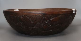 An African carved wood bowl, diameter 43cm