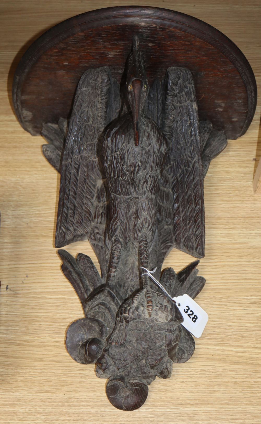 A 19th century Black Forest carved wood 'heron' wall bracket, H.40cm