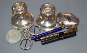 A George V silver trinket box, a pair of silver dwarf candlesticks(a.f.), pierced silver brooch,