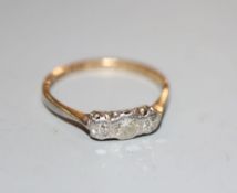 A 1930's 18ct and plat three stone diamond ring, size M, gross 1.7 grams.CONDITION: One stone has