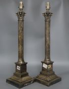 A pair of electroplated corinthian column lamps, height 50cm excluding electrical fittings
