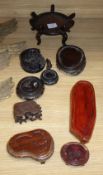 Nine various Oriental hardwood stands