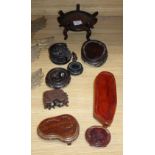 Nine various Oriental hardwood stands