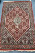 A Kashan rug, 166 x 109cm