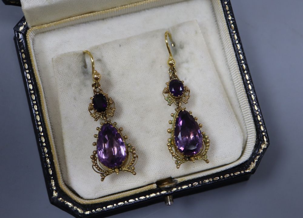A pair of Victorian yellow metal and two stone amethyst set drop earrings, 38mm excluding ear
