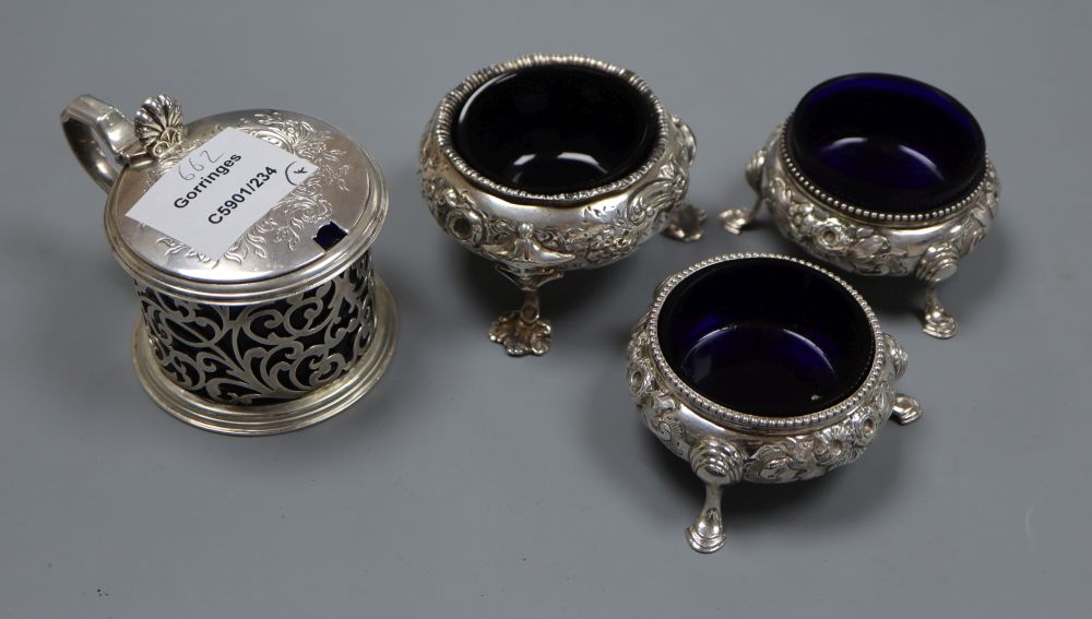 A Victorian pierced silver mustard pot, London, 1845, a pair of silver salts, London, 1859 and one