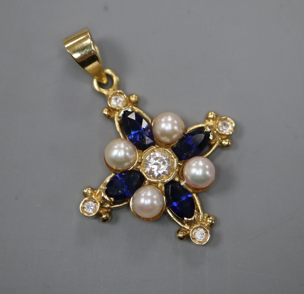 A modern 750 yellow metal, white and blue sapphire and cultured pearl set star pendant, 23mm,