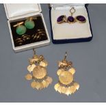 A pair of modern 18k and amethyst coloured cabochon cufflinks and matching dress stud, gross 16.5