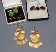 A pair of modern 18k and amethyst coloured cabochon cufflinks and matching dress stud, gross 16.5