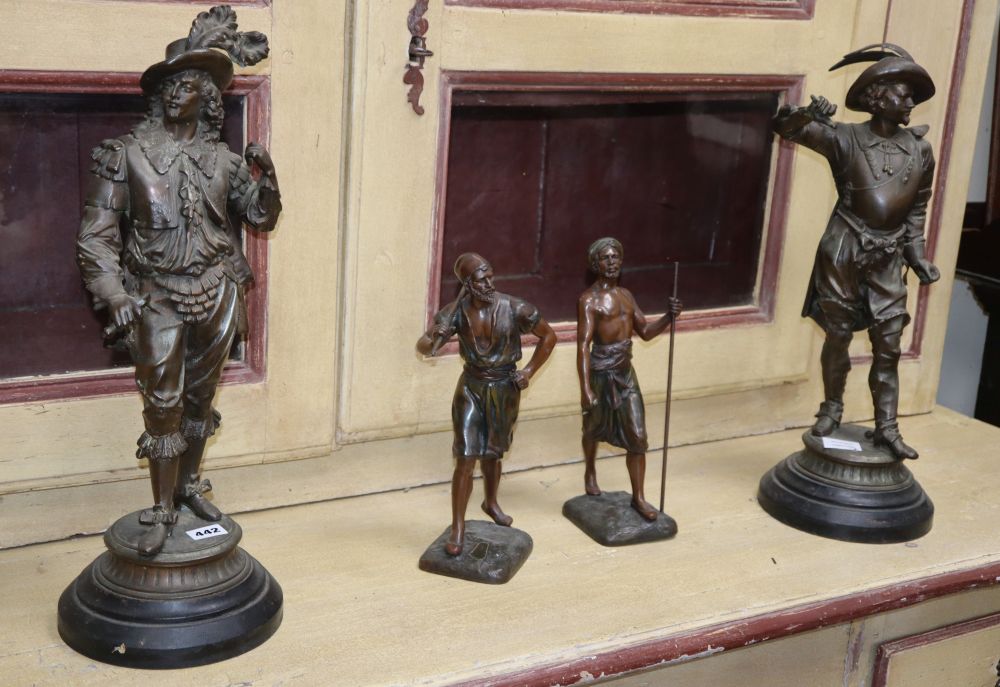 A pair of spelter cavaliers, height 52cm and a pair of Indian warriors