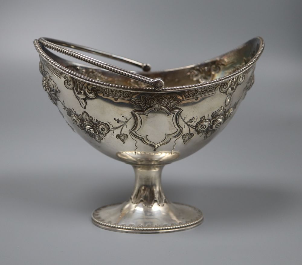 A Victorian embossed silver boat shaped sugar basket (lacking liner), Martin, Hall & Co,