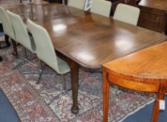 A Georgian style mahogany drop leaf extending dining table, 230cm extended (two spare leaves), D.