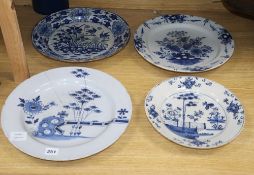 Four 18th century Delft blue and white dishes, largest 35cm (a.f.)CONDITION: All four dishes have