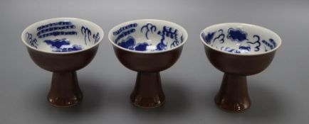 Three Chinese dragon stem cups, with blue and white interior, height 9cmCONDITION: Appear to be in