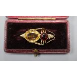 A yellow metal (tests as high carat), garnet and citrine set bug brooch, with diamond set eyes,