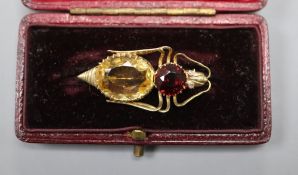 A yellow metal (tests as high carat), garnet and citrine set bug brooch, with diamond set eyes,