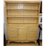 A painted bookcase / chest, W.113cm, D.25cm, H.163cm.CONDITION: The paintwork on the tiers is