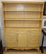 A painted bookcase / chest, W.113cm, D.25cm, H.163cm.CONDITION: The paintwork on the tiers is