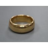 A gentleman's George V 18ct gold wedding band, size S, 16.5 grams.CONDITION: A few dings and