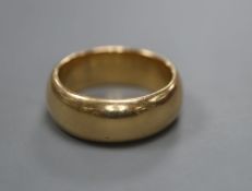 A gentleman's George V 18ct gold wedding band, size S, 16.5 grams.CONDITION: A few dings and