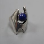A post 1945 Georg Jensen sterling and cabochon lapis lazuli dress ring, design no. 139, size O,