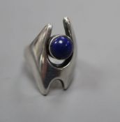 A post 1945 Georg Jensen sterling and cabochon lapis lazuli dress ring, design no. 139, size O,