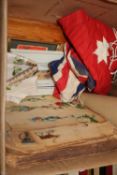 An Australian Naval ensign, a Union Jack stevengraph, a scrap book, a painted panel, a book 'The