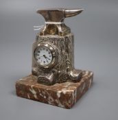 A late Victorian novelty silver mounted timepiece, modelled as an anvil upon a tree stump, Douglas