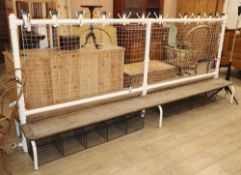 A vintage cast iron double school changing room bench, with wood seats, W.300cm D.62cm H.130cm