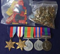 Two Burma medals, World War I sew on badges, a group of World War II medals and badges