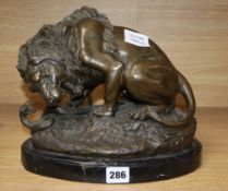 After A. Barye. A bronze of lion and a snake, height 24cm