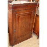 A George III oak hanging corner cupboard, W.82cm, D.41cm, H.106cm