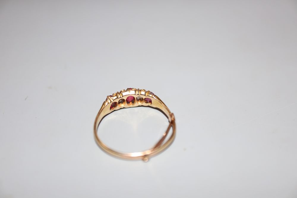 A yellow metal, ruby and diamond set five stone half hoop ring, size P, gross weight 2.2 grams. - Image 3 of 3