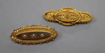 Two Victorian 15ct oval brooches, with cannetile work decoration, one with seed pearls and one